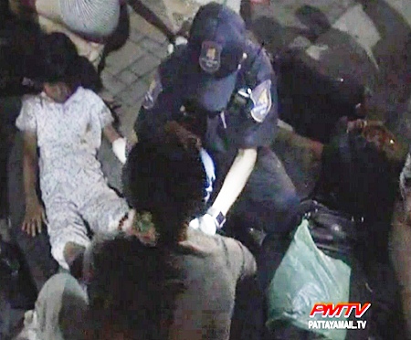 One of the younger passengers is helped by volunteers.